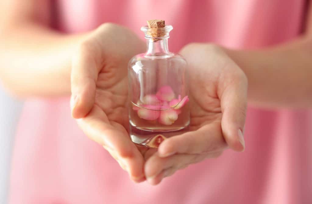 Woman,Holding,Bottle,Of,Aroma,Oil,,Closeup